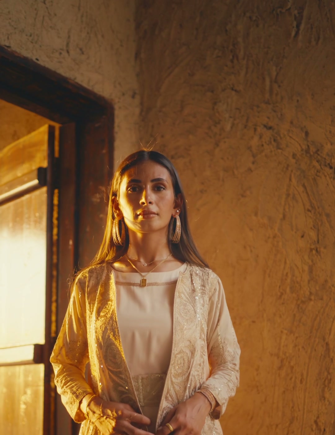 Model wearing an embroidered outfit in the HIA campaign